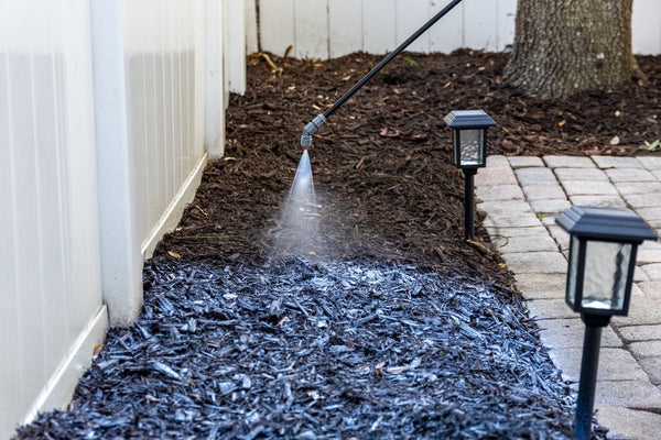 Neatly mulched garden bed kept tidy and secure with mulch glue